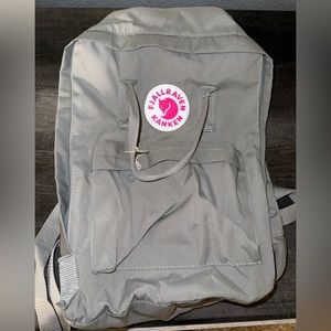 Green gray fjällräven kanken backpack.